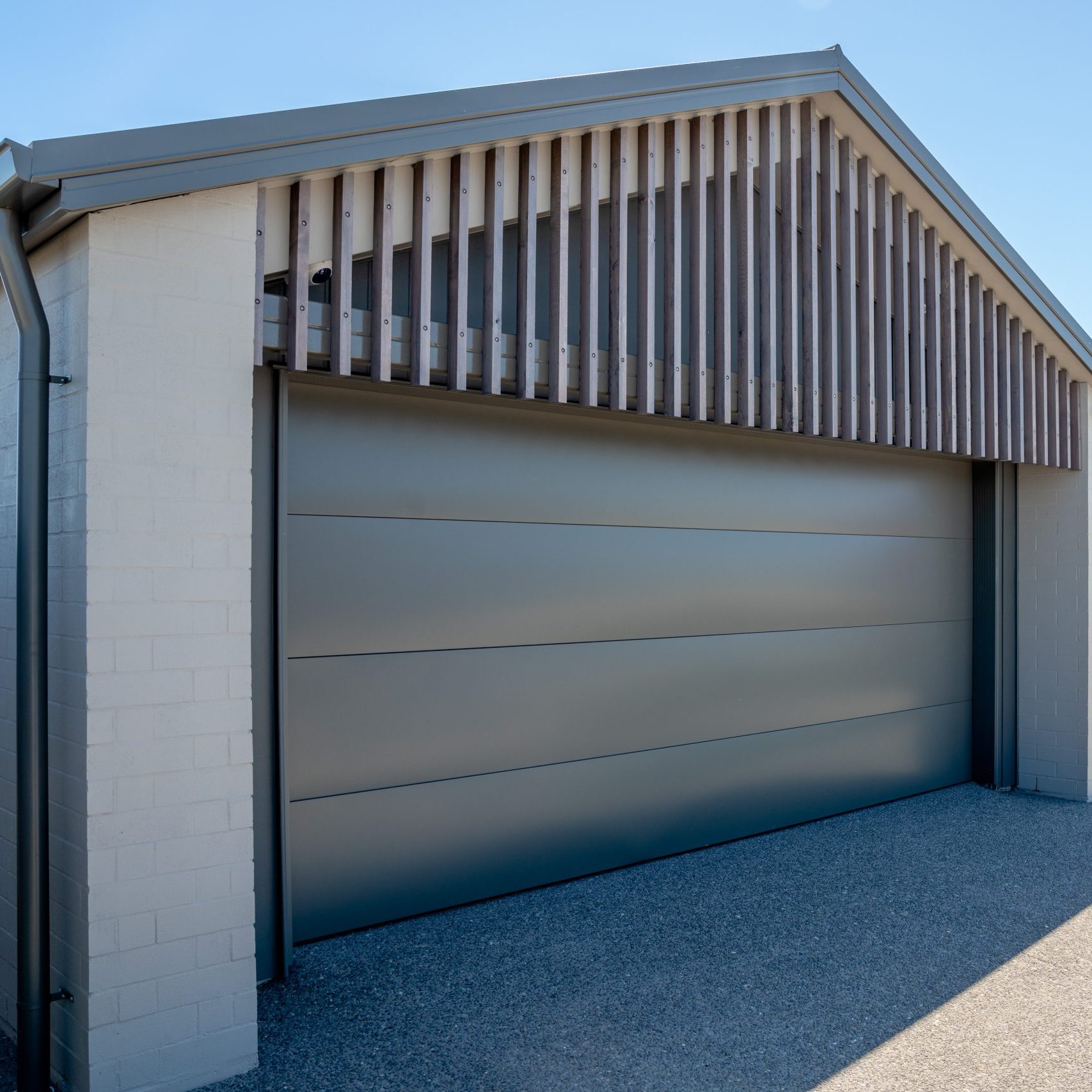 COLORSTEEL sectional garage door in woodgrain finish on a Christchurch home